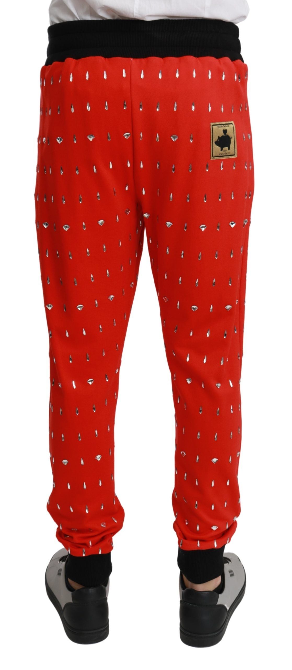 Dolce &amp; Gabbana Chic Pantalon de survêtement rouge à imprimé tirelire