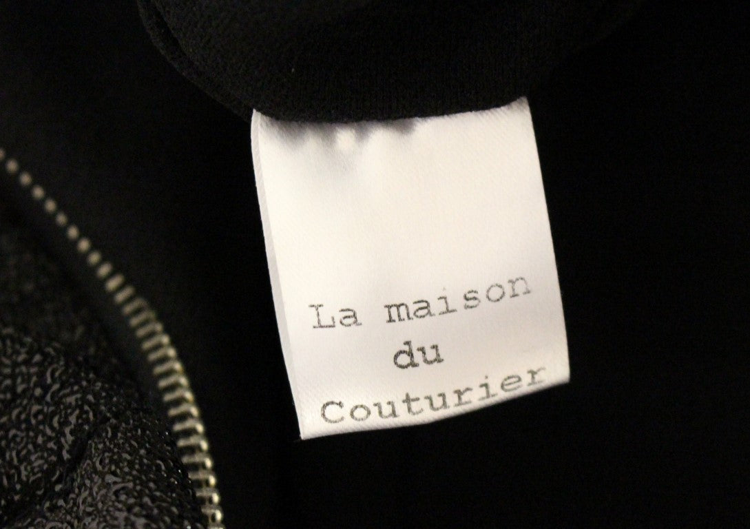 La Maison du Couturier Combinaison élégante en cuir noir avec sangle à la taille